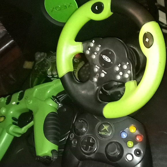 I'm showing my original Xbox console and controllers, gun,and steering wheel - Picture 2 of 4